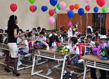 Knowledge Day is the first bells and excitements, bunch of flowers and white bows, Baku, Azerbaijan, Sept.15, 2011 