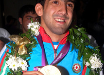 Sərbəst güləş üzrə olimpiya çempionu Toğrul Əsgərov. Bakı, Azərbaycan, 15 avqust 2012