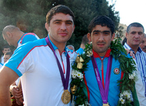 Olympic champion on wrestling Sharif Sharifov and Toghrul Asgerov. Baku, Azerbaijan, Aug.15, 2012