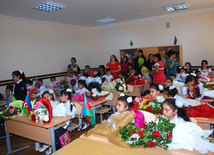 Knowledge Day is the first bells and excitements, bunch of flowers and white bows, Baku, Azerbaijan, Sept.15, 2012