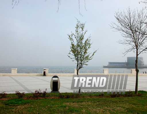 Spring with its warm breath, green costume and mist kerchief. Baku, Azerbaijan, March 28, 2013