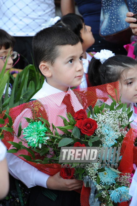 Knowledge Day is the first bells and excitements, bunch of flowers and white bows. Baku, Azerbaijan, Sept.16, 2013