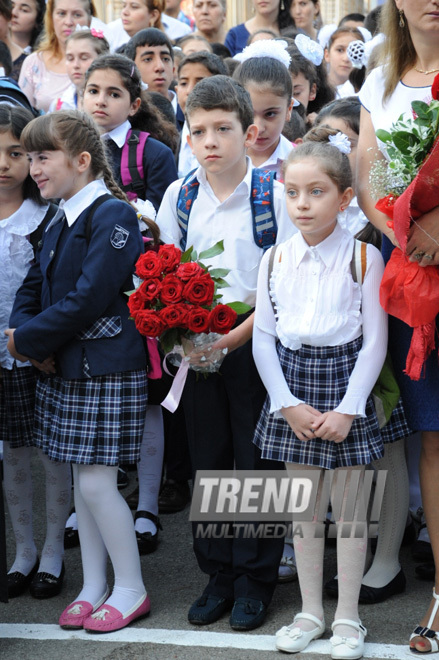 Knowledge Day is the first bells and excitements, bunch of flowers and white bows. Baku, Azerbaijan, Sept.16, 2013