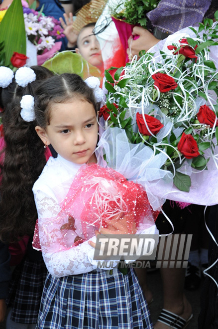 Knowledge Day is the first bells and excitements, bunch of flowers and white bows. Baku, Azerbaijan, Sept.16, 2013