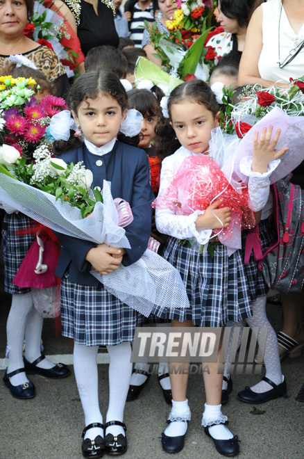 Knowledge Day is the first bells and excitements, bunch of flowers and white bows. Baku, Azerbaijan, Sept.16, 2013