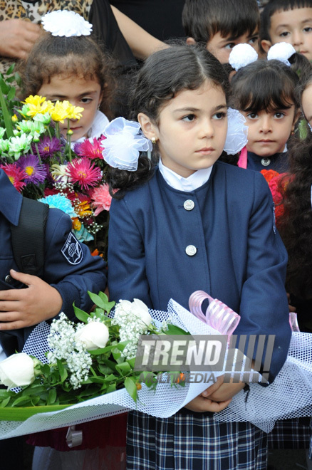 Knowledge Day is the first bells and excitements, bunch of flowers and white bows. Baku, Azerbaijan, Sept.16, 2013