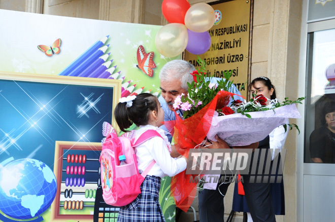 Knowledge Day is the first bells and excitements, bunch of flowers and white bows. Baku, Azerbaijan, Sept.16, 2013