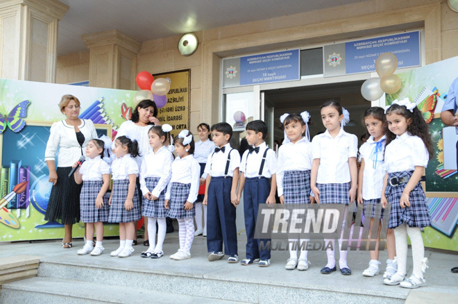 Knowledge Day is the first bells and excitements, bunch of flowers and white bows. Baku, Azerbaijan, Sept.16, 2013