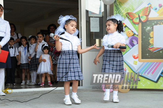 Knowledge Day is the first bells and excitements, bunch of flowers and white bows. Baku, Azerbaijan, Sept.16, 2013