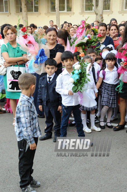 Knowledge Day is the first bells and excitements, bunch of flowers and white bows. Baku, Azerbaijan, Sept.16, 2013