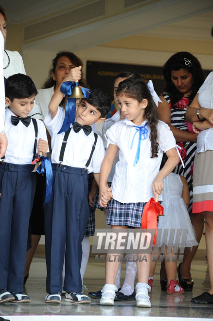 Knowledge Day is the first bells and excitements, bunch of flowers and white bows. Baku, Azerbaijan, Sept.16, 2013