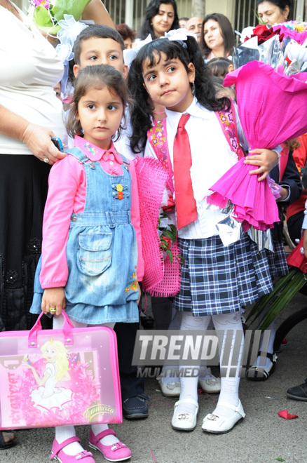 Knowledge Day is the first bells and excitements, bunch of flowers and white bows. Baku, Azerbaijan, Sept.16, 2013