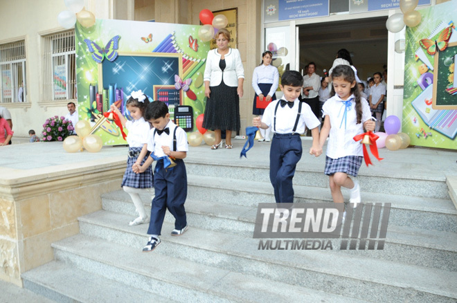 Knowledge Day is the first bells and excitements, bunch of flowers and white bows. Baku, Azerbaijan, Sept.16, 2013