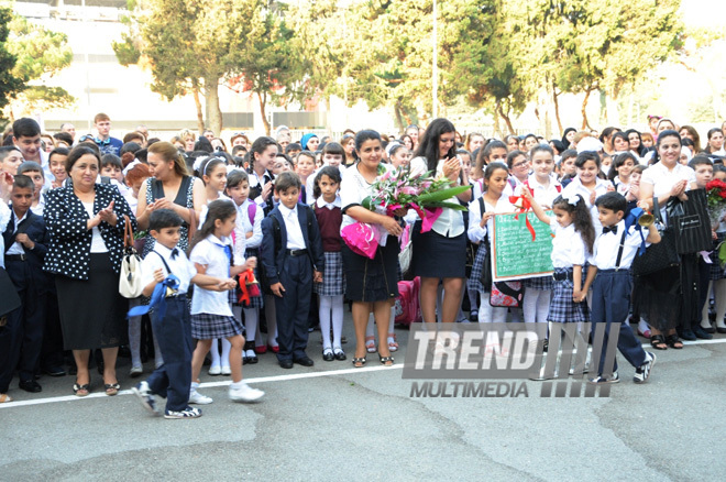 Knowledge Day is the first bells and excitements, bunch of flowers and white bows. Baku, Azerbaijan, Sept.16, 2013