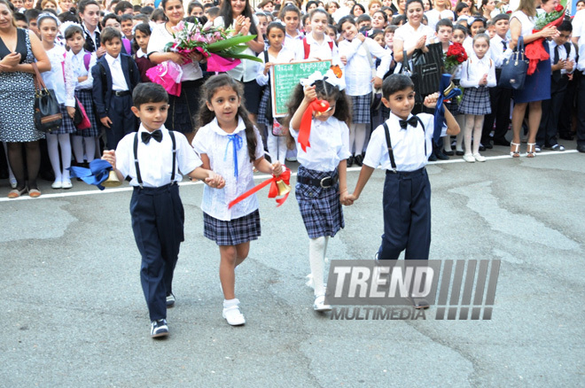 Knowledge Day is the first bells and excitements, bunch of flowers and white bows. Baku, Azerbaijan, Sept.16, 2013