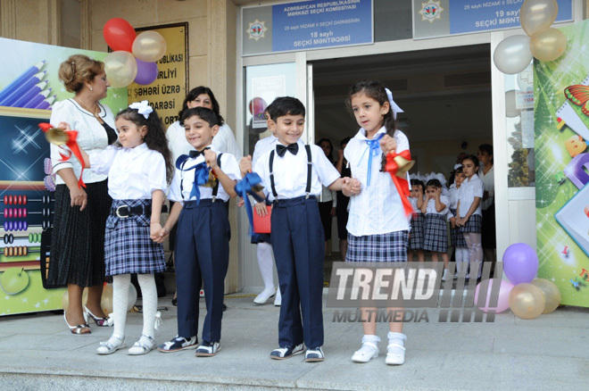 Knowledge Day is the first bells and excitements, bunch of flowers and white bows. Baku, Azerbaijan, Sept.16, 2013