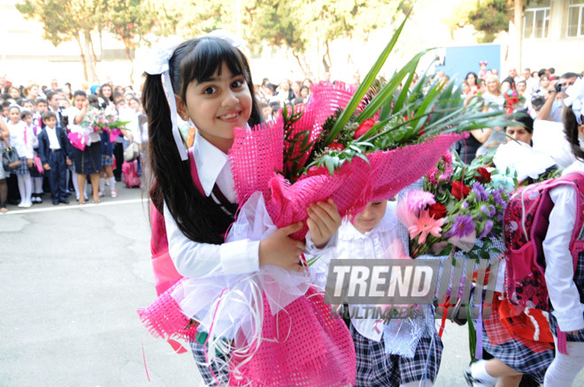 Knowledge Day is the first bells and excitements, bunch of flowers and white bows. Baku, Azerbaijan, Sept.16, 2013