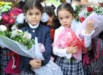 Knowledge Day is the first bells and excitements, bunch of flowers and white bows, Baku, Azerbaijan, Sept.16, 2013