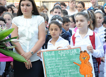 Knowledge Day is the first bells and excitements, bunch of flowers and white bows, Baku, Azerbaijan, Sept.16, 2013