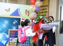 Knowledge Day is the first bells and excitements, bunch of flowers and white bows, Baku, Azerbaijan, Sept.16, 2013