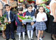 Knowledge Day is the first bells and excitements, bunch of flowers and white bows, Baku, Azerbaijan, Sept.16, 2013