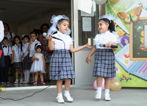 Knowledge Day is the first bells and excitements, bunch of flowers and white bows, Baku, Azerbaijan, Sept.16, 2013