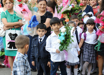 Knowledge Day is the first bells and excitements, bunch of flowers and white bows, Baku, Azerbaijan, Sept.16, 2013