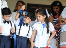 Knowledge Day is the first bells and excitements, bunch of flowers and white bows, Baku, Azerbaijan, Sept.16, 2013