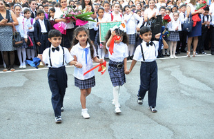 Knowledge Day is the first bells and excitements, bunch of flowers and white bows. Baku, Azerbaijan, Sept.16, 2013